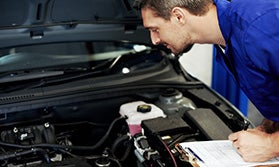 Mechanic Checking an Engine